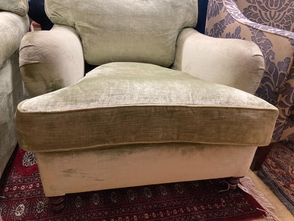 A George Smith Howard style armchair upholstered in pale green velvet, width 80cm, depth 110cm, height 82cm